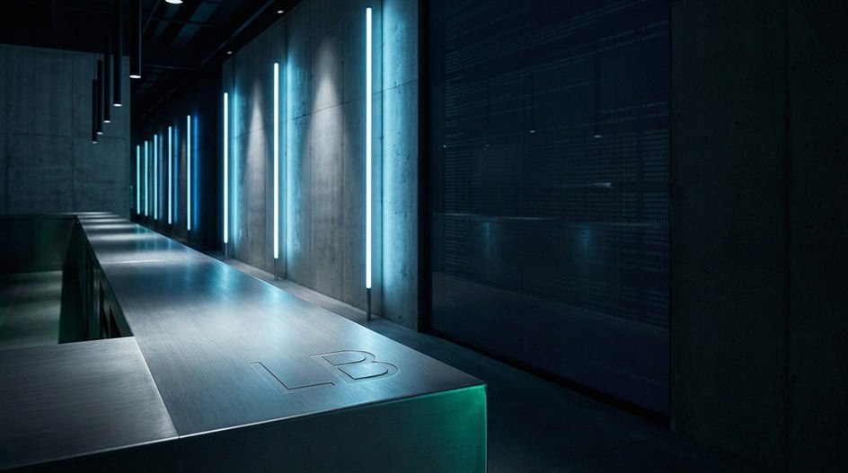 Modern casino floor with player at gaming terminal